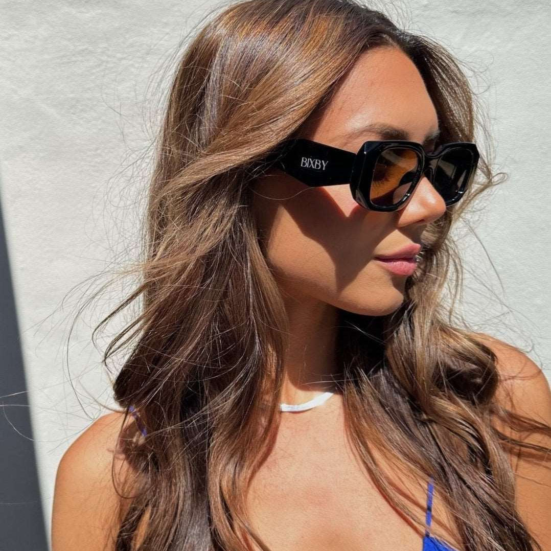 Model wearing our Bixby black sunglasses