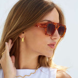 Orange rim Banks Sunglasses on model 