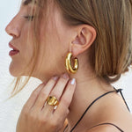 Sandra modeling new Sculpt collection hoop earrings 