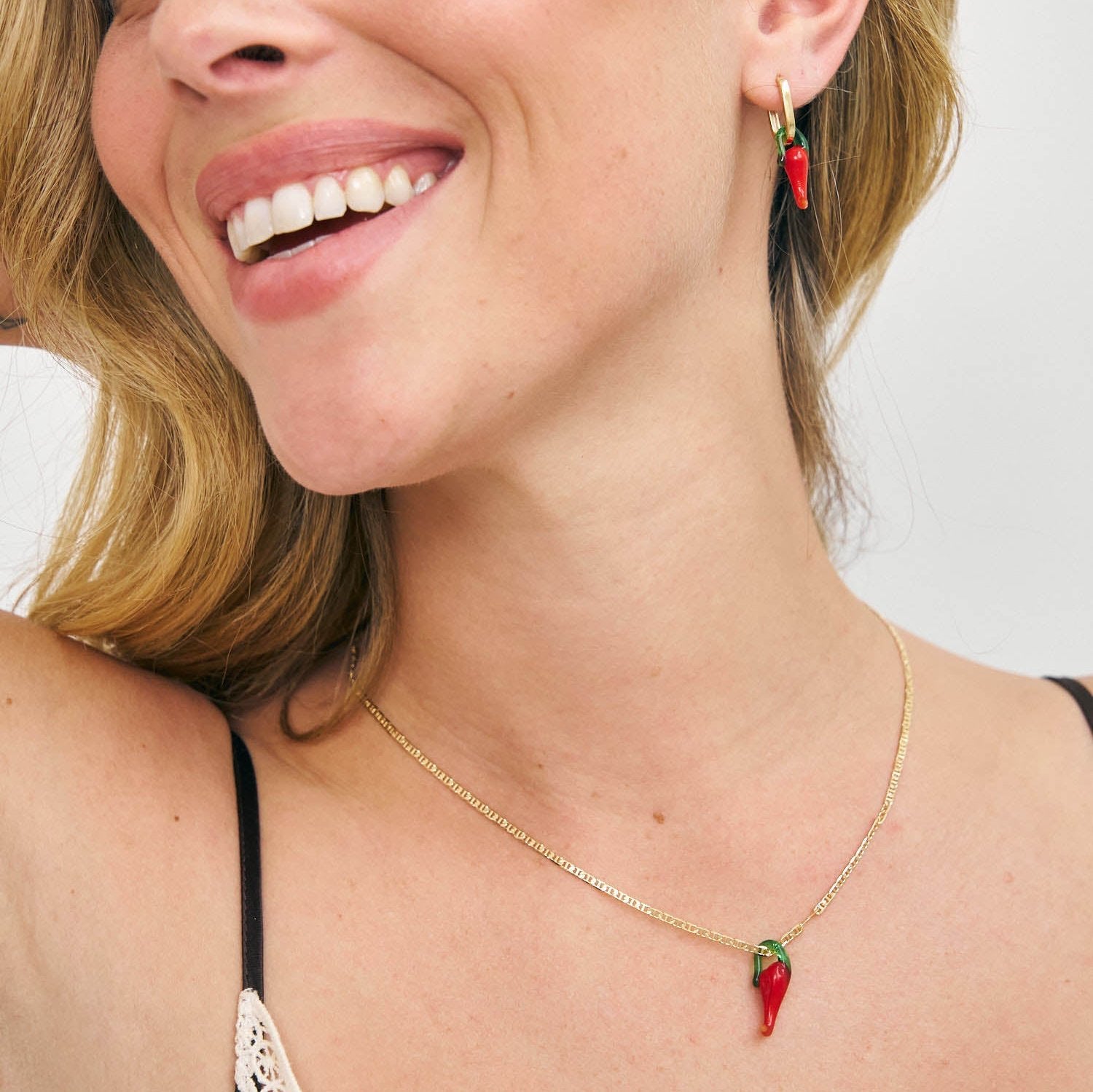 Model in red chilli pendant necklace and earrings 