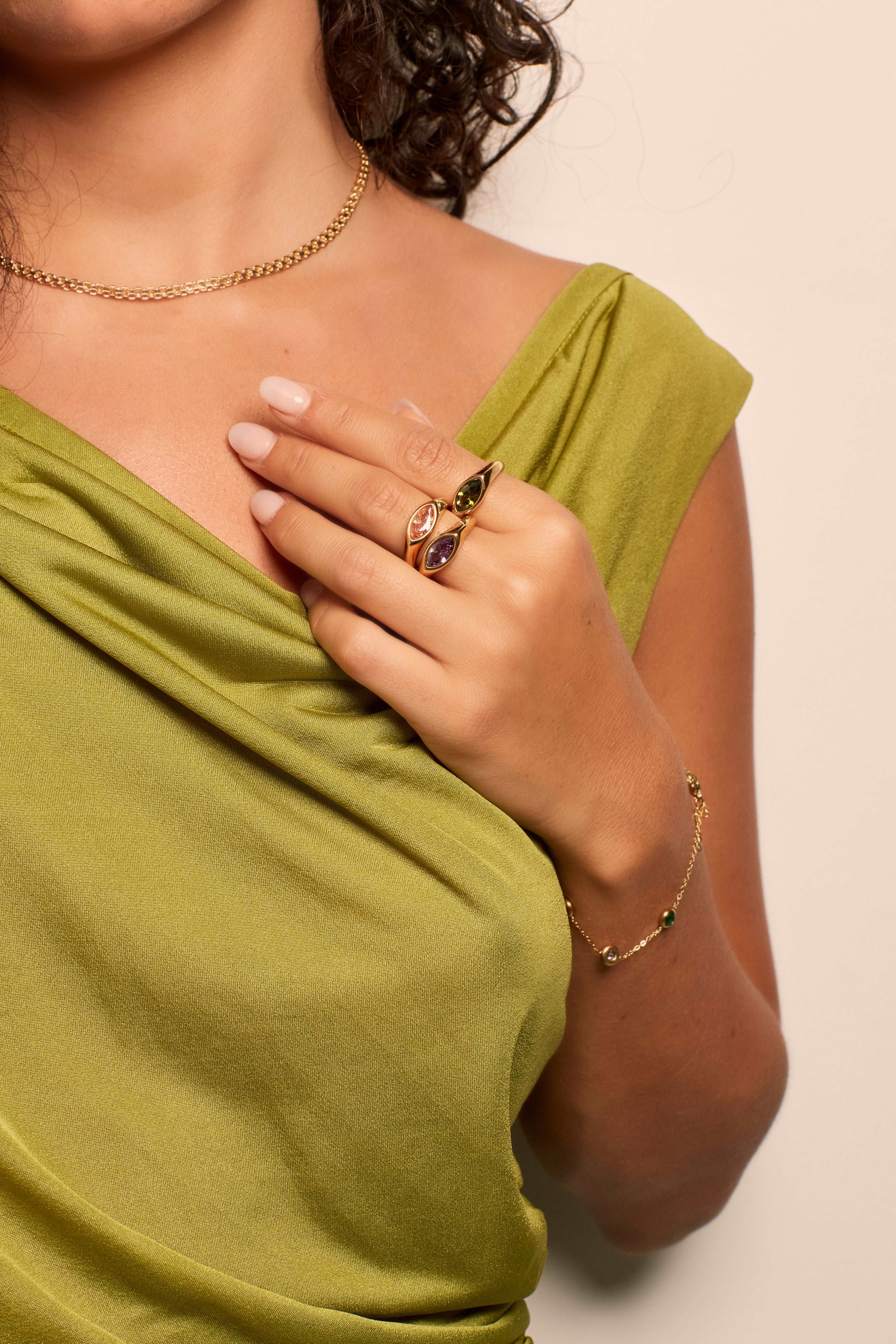 Model in coloured oval gemstone rings from Bixby and Co 