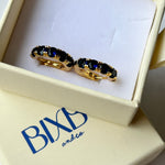 Sapphire blue crystal and gold huggies from Bixby and Co