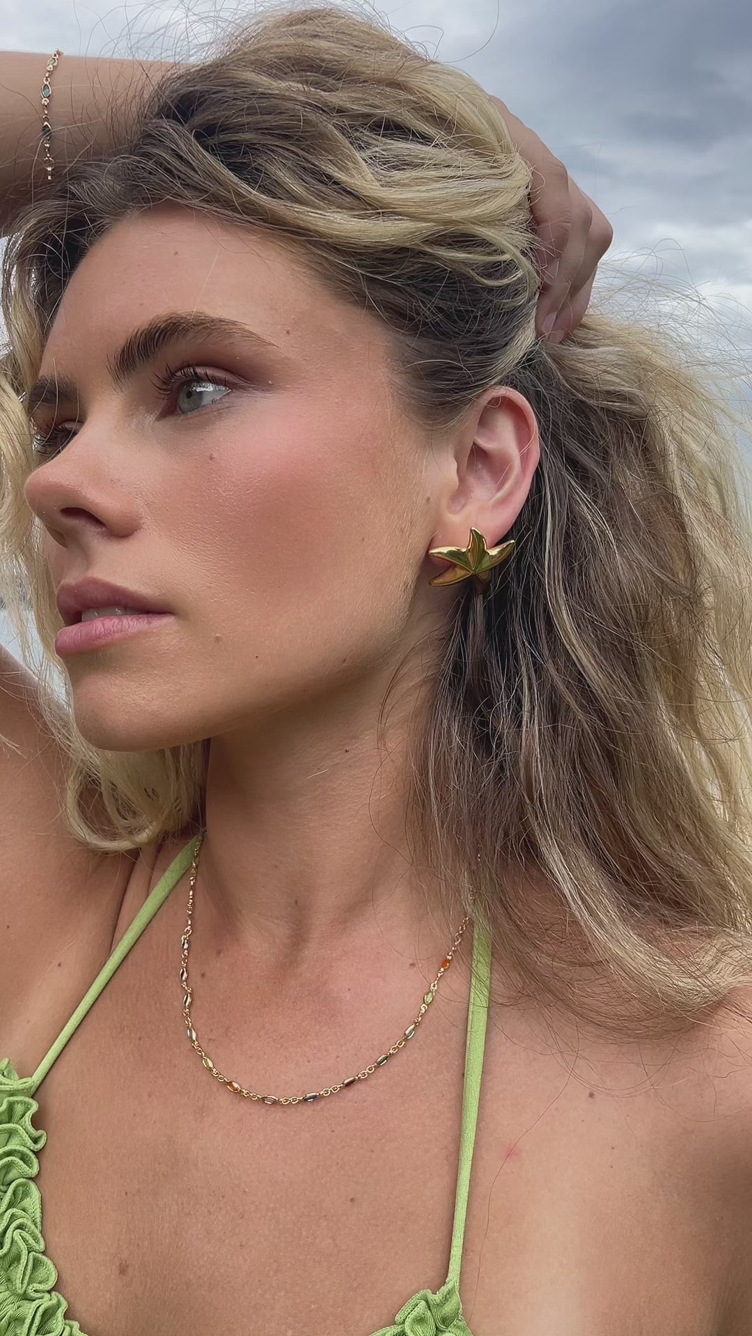 Video of model in 18k gold fill starfish earrings 