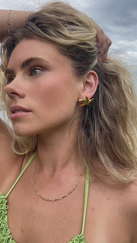 Video of model in 18k gold fill starfish earrings 