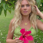 Video of model in Hibiscus flower, tropical, resort wear flower pendant and earrings