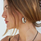 Model in Bixby and co silver Kahlo earrings 