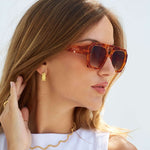Orange rim Banks Sunglasses on model 